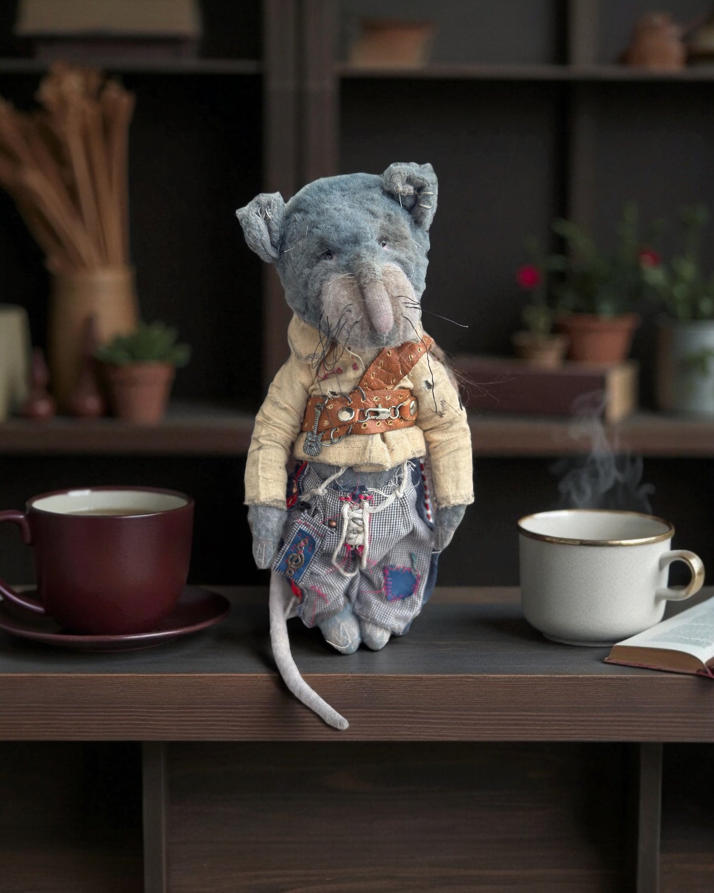 Milo the vintage plush mouse at a cozy coffee table with two mugs.